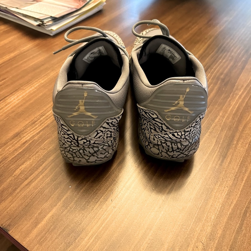Gray Jordan golf shoes, size 12. No major blemishes. Taken care of